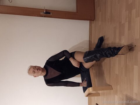 Pathetic sissy exposed in slutty black boots and sheer bodysuit. Just a disgusting loser begging to be mocked